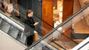 Woman on an escalator on the cover of Circular Voice 2023
