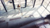 An aerial view of a woman leaving a shopping centre